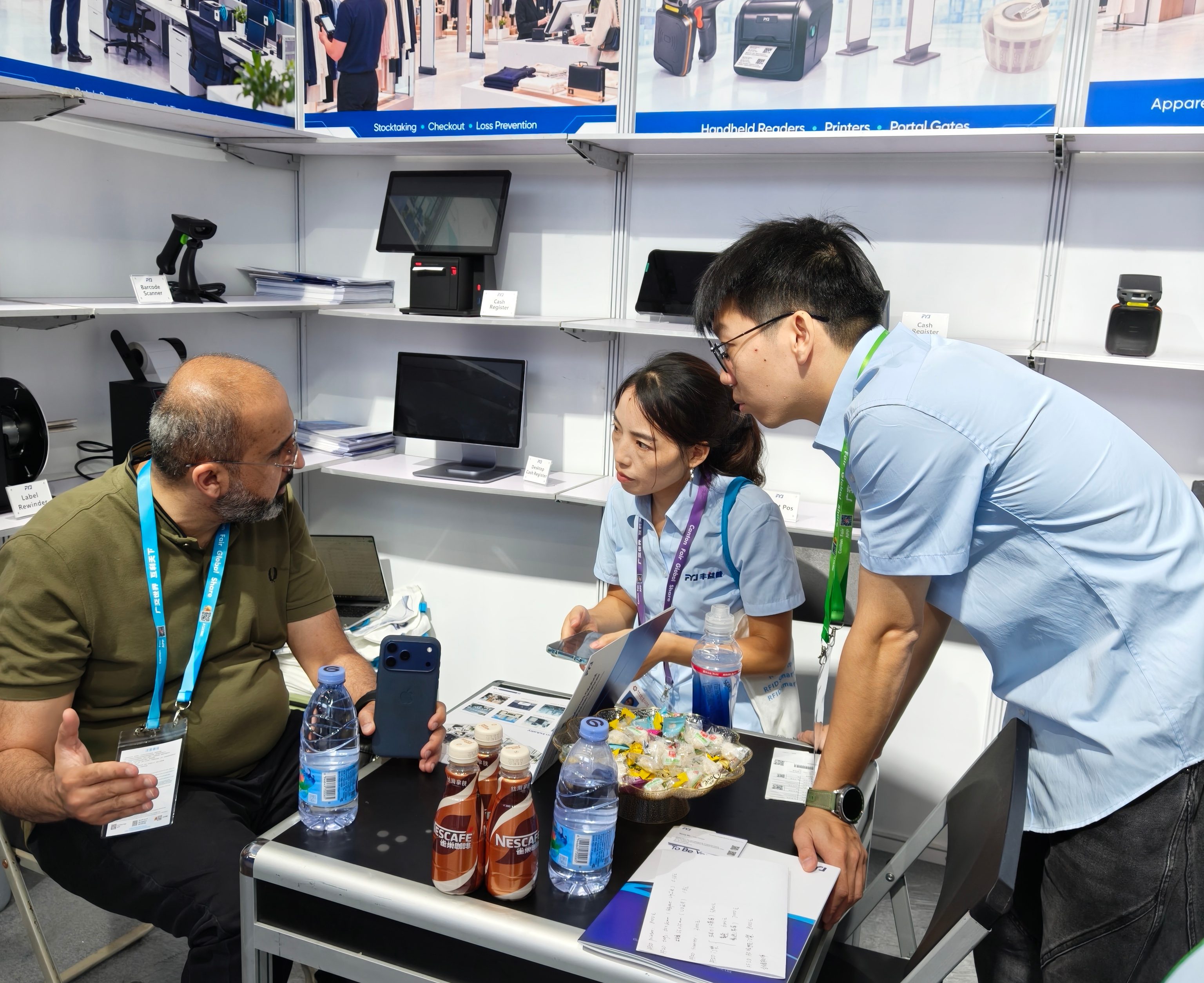 Discussing Real RFID Project Requirements Visitors discussing RFID warehouse, retail and system integration requirements with the FYJ team